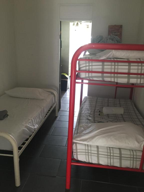 Postel nebo postele na pokoji v ubytování Vieques Good Vibe Guest House