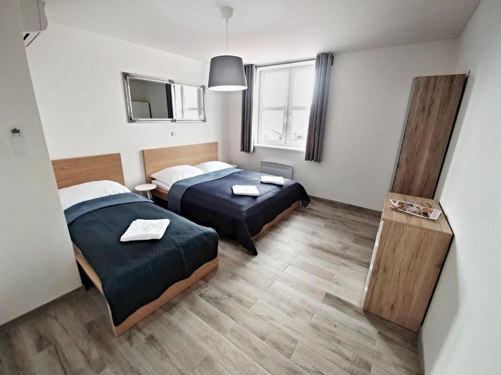 Postel nebo postele na pokoji v ubytování Penzion jako víno