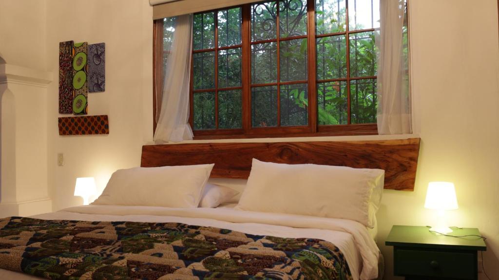 Postel nebo postele na pokoji v ubytování Iguanazu Bed & Breakfast
