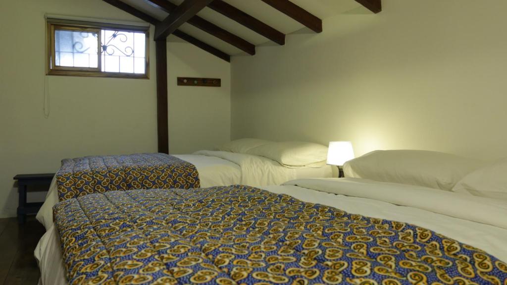 Postel nebo postele na pokoji v ubytování Iguanazu Bed & Breakfast