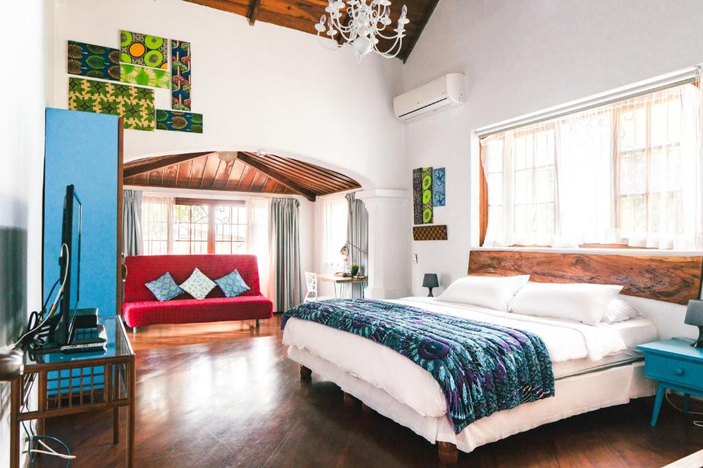 Postel nebo postele na pokoji v ubytování Iguanazu Bed & Breakfast