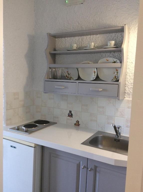 Kuchyň nebo kuchyňský kout v ubytování Maria Suites