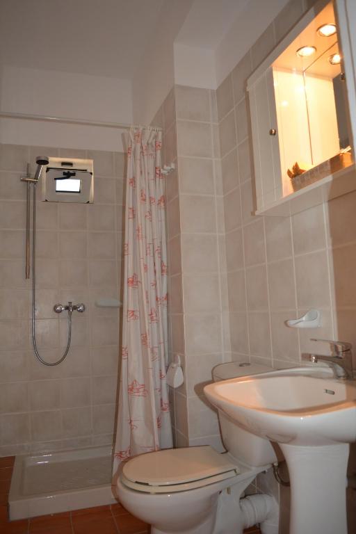 A bathroom at Raph's Studios-Apts By The Sea