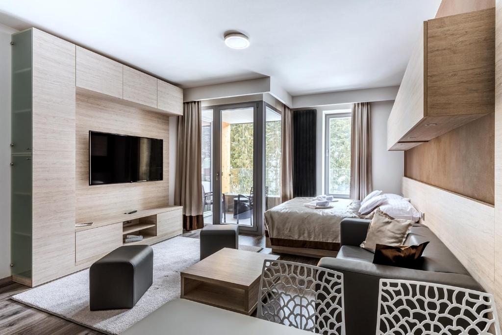 TV a/nebo společenská místnost v ubytování HOTEL PECR WELL