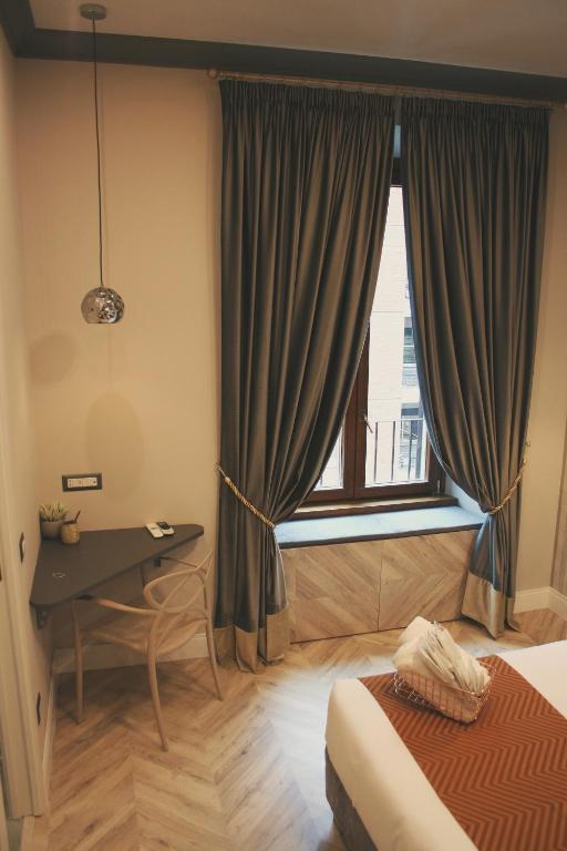 Postel nebo postele na pokoji v ubytování Hotel Roma Vaticano