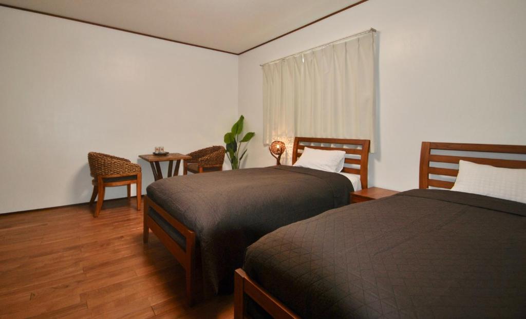 Postel nebo postele na pokoji v ubytování 女性専用 Inn By The Sea Kamakura - Women's Guesthouse