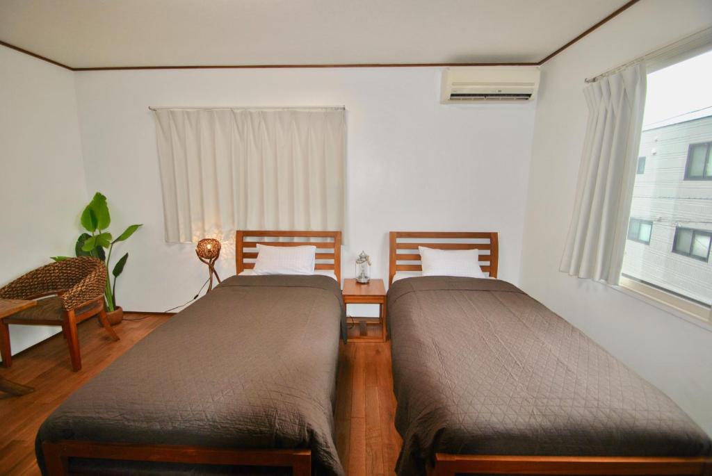 Postel nebo postele na pokoji v ubytování 女性専用 Inn By The Sea Kamakura - Women's Guesthouse