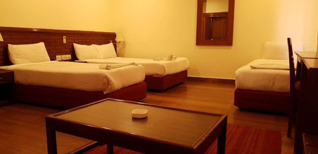 Letto o letti in una camera di Hotel The White Lotus View Pvt Ltd