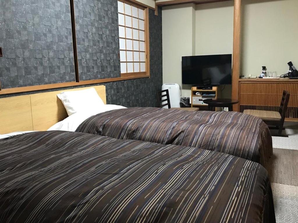 Postel nebo postele na pokoji v ubytování Ark Hotel Okayama -ROUTE INN HOTELS-