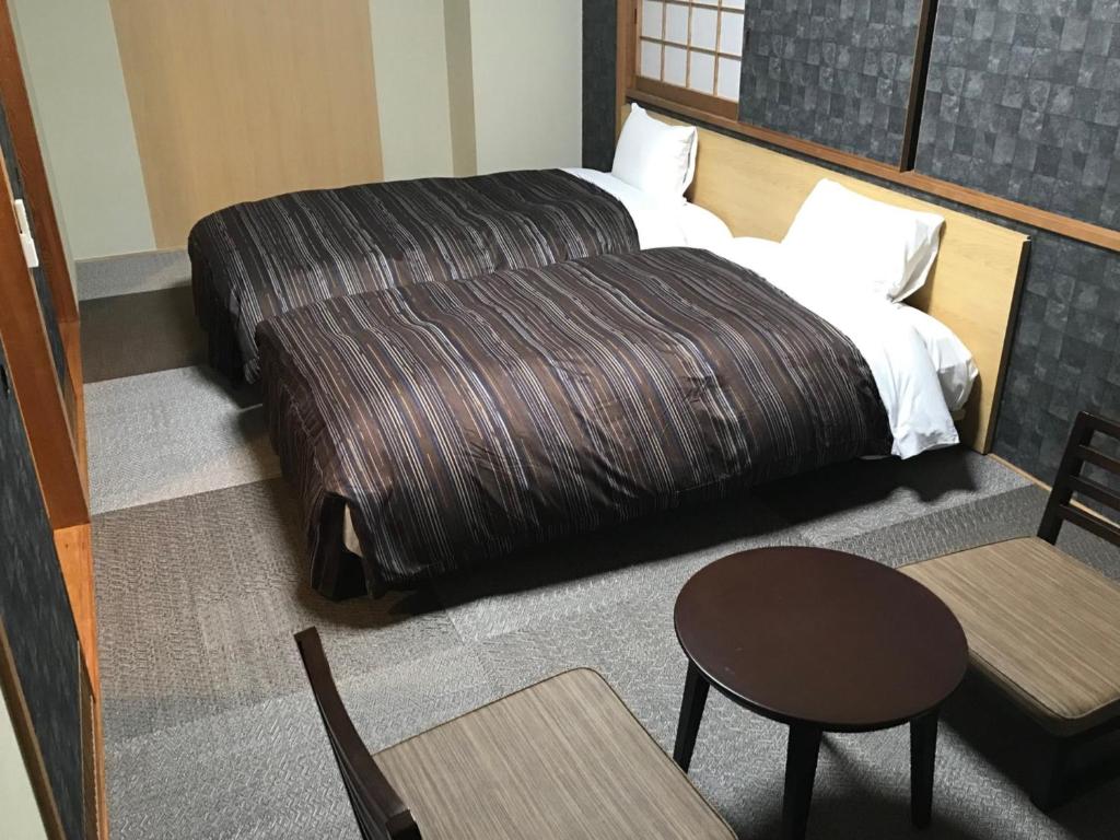 Postel nebo postele na pokoji v ubytování Ark Hotel Okayama -ROUTE INN HOTELS-
