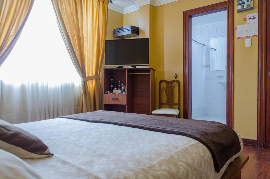 Postel nebo postele na pokoji v ubytování Hotel El Altar
