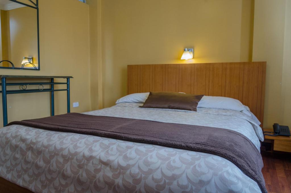 Postel nebo postele na pokoji v ubytování Hotel El Altar