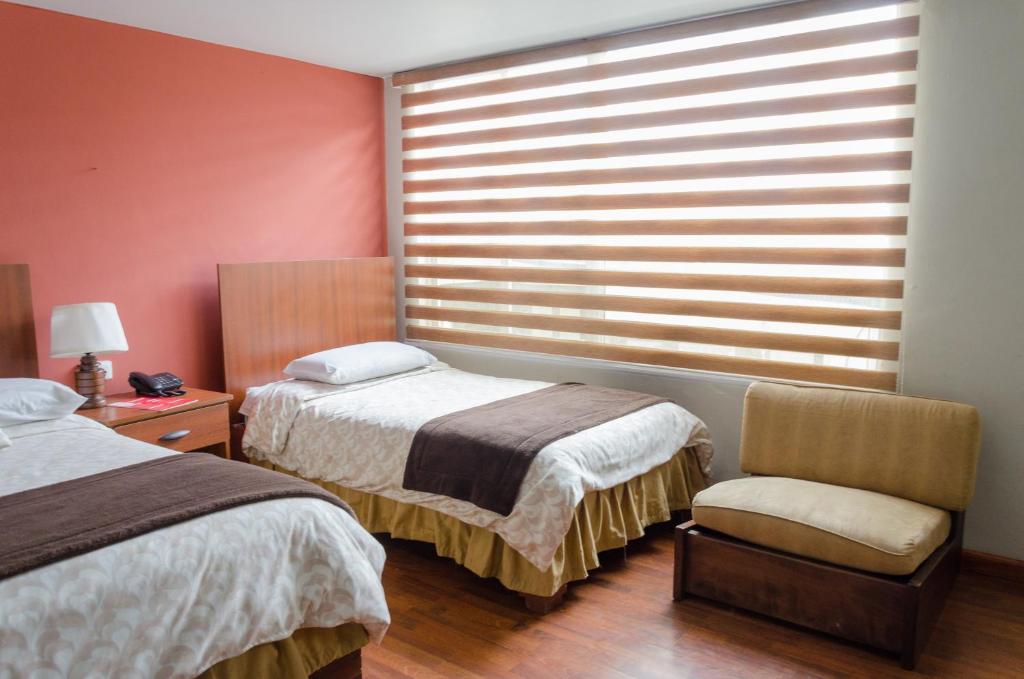 Postel nebo postele na pokoji v ubytování Hotel El Altar