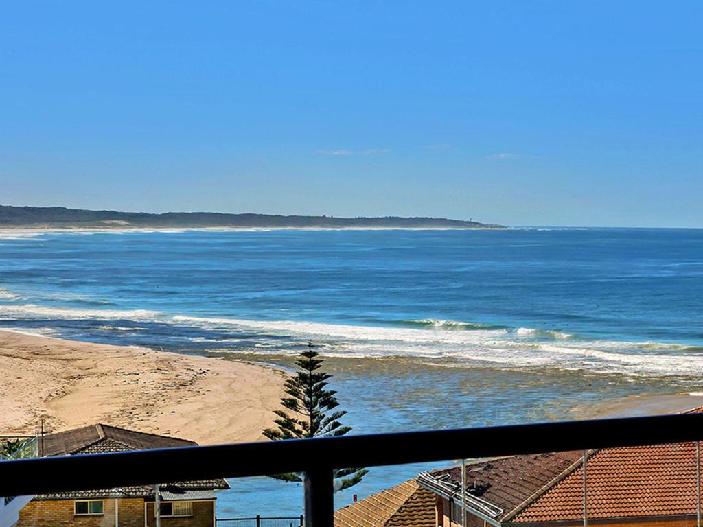 a view of the ocean from a balcony at Crystal Views 24 in The Entrance