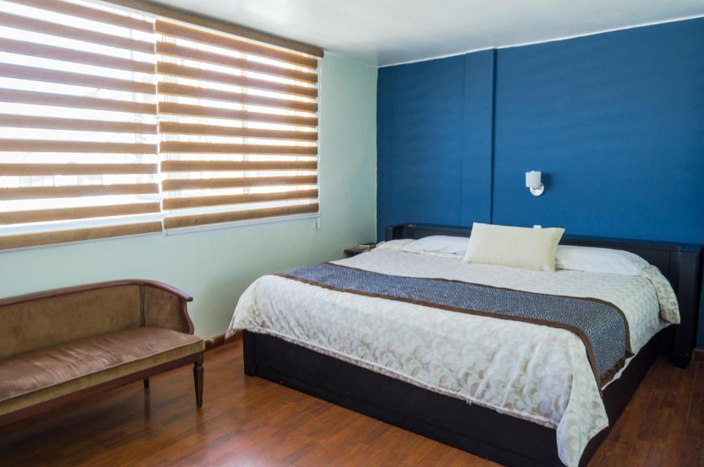 Postel nebo postele na pokoji v ubytování Hotel El Altar
