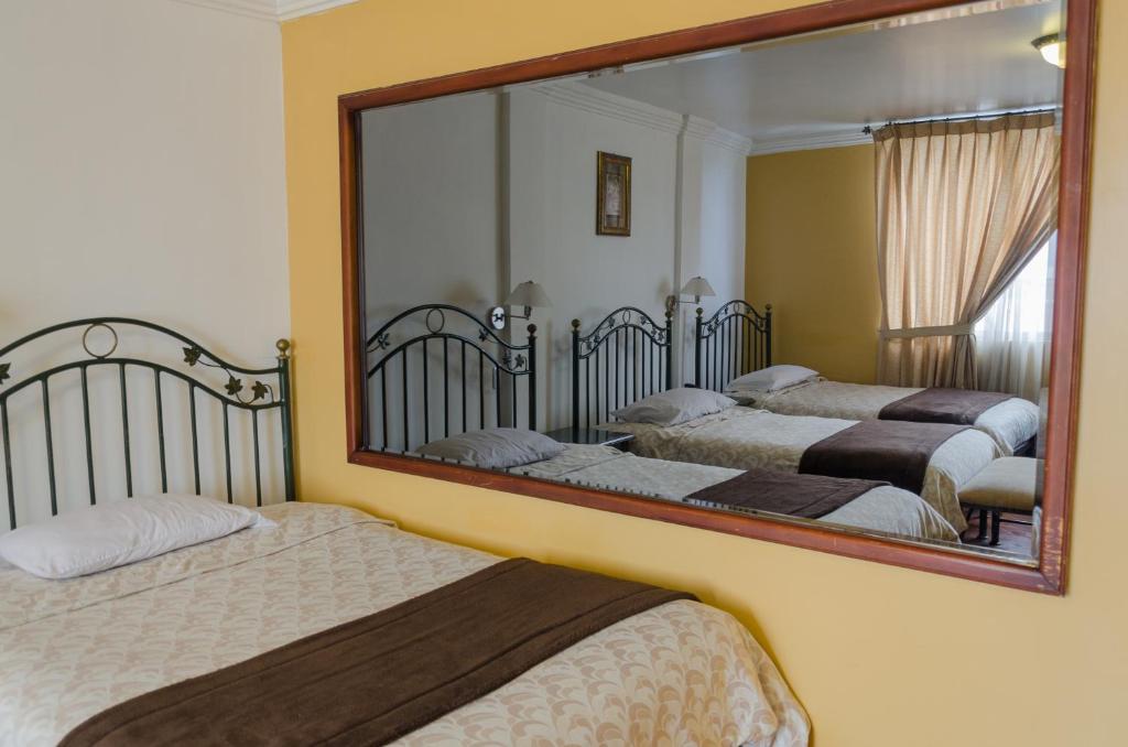 Postel nebo postele na pokoji v ubytování Hotel El Altar