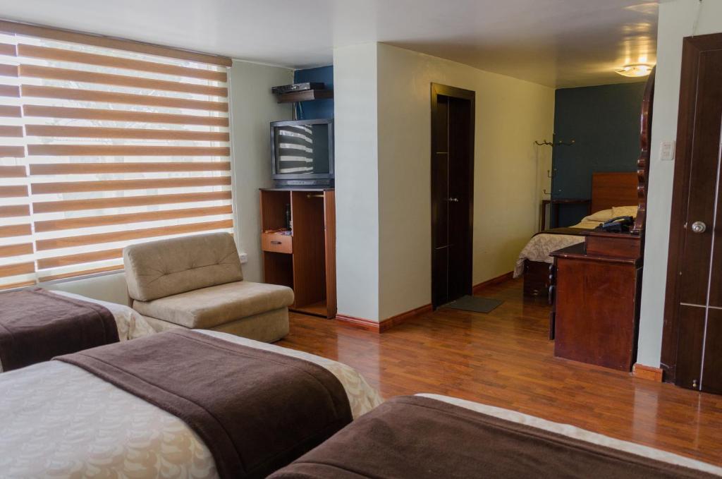 Postel nebo postele na pokoji v ubytování Hotel El Altar