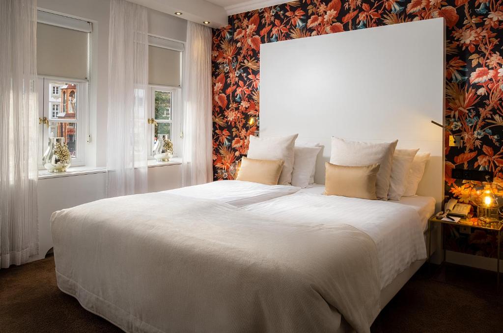 Postel nebo postele na pokoji v ubytování Van der Valk Hotel Hildesheim