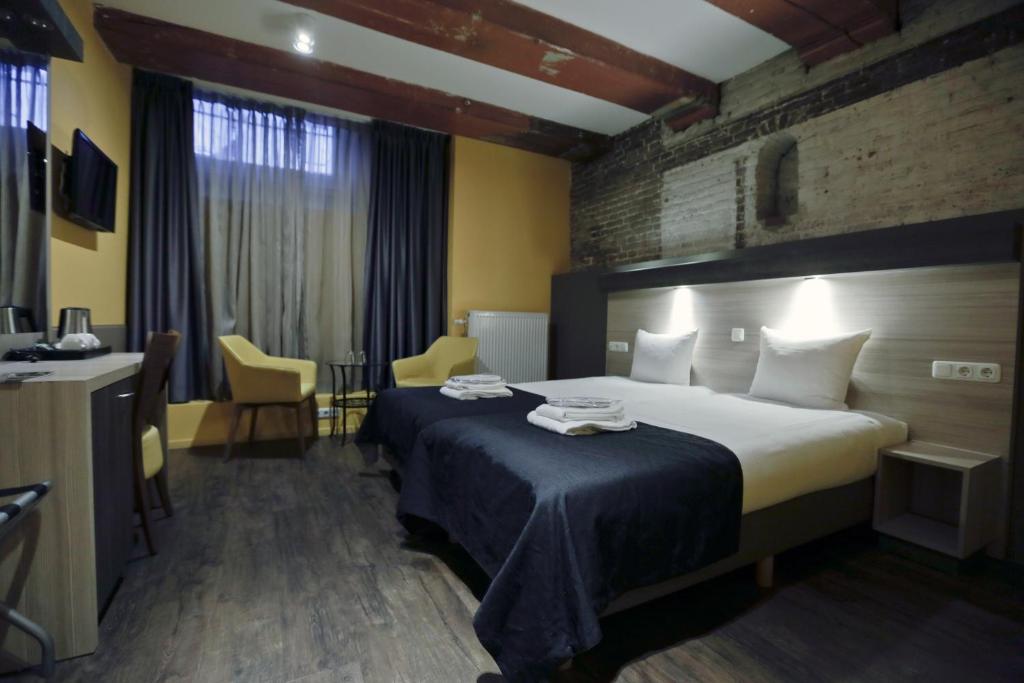 Postel nebo postele na pokoji v ubytování City Hotel Amsterdam