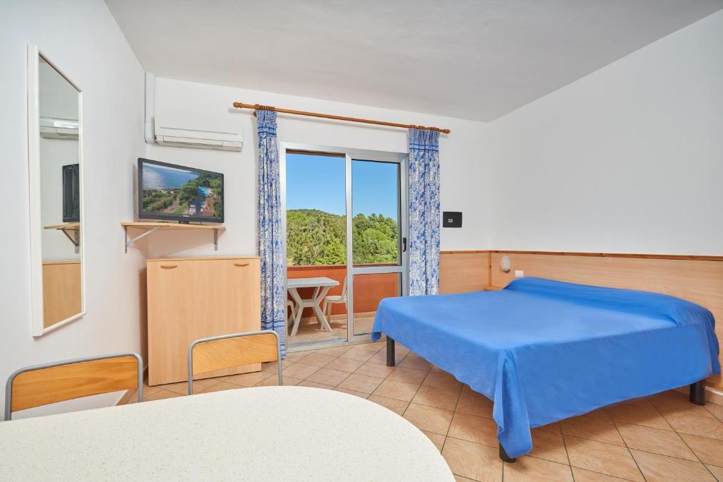 Postel nebo postele na pokoji v ubytování Residence Reale