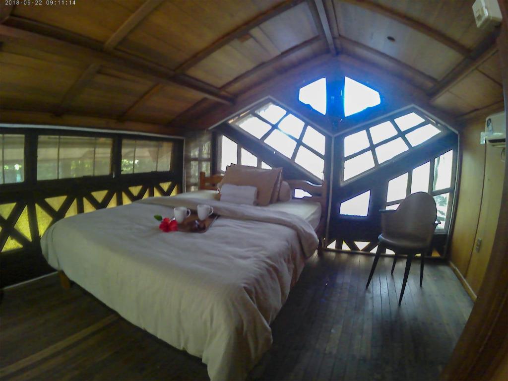 Postel nebo postele na pokoji v ubytování Karang Aji Beach Villa