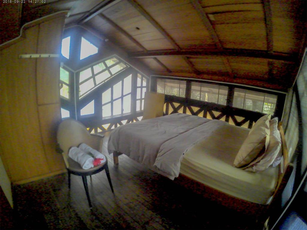 Postel nebo postele na pokoji v ubytování Karang Aji Beach Villa