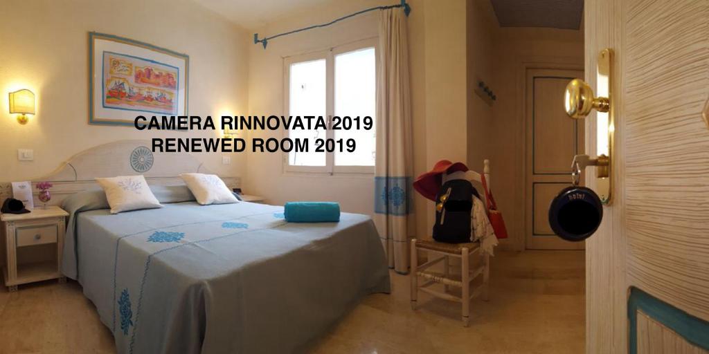 Postel nebo postele na pokoji v ubytování Hotel Riviera