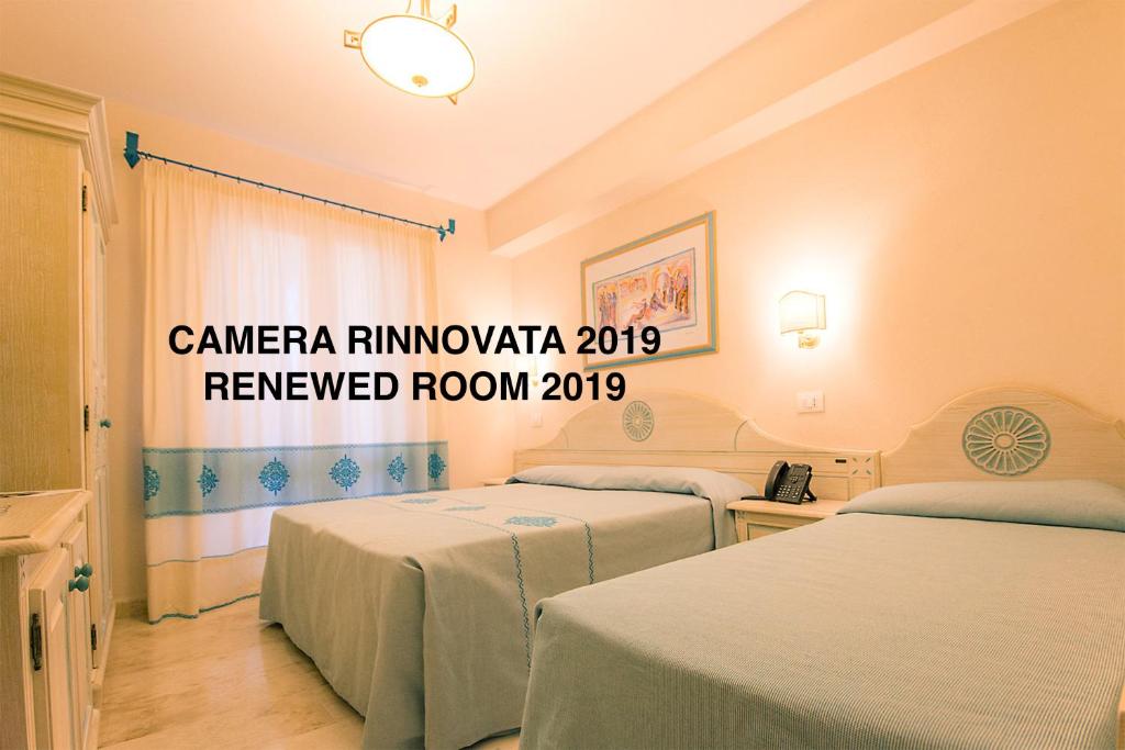 Postel nebo postele na pokoji v ubytování Hotel Riviera