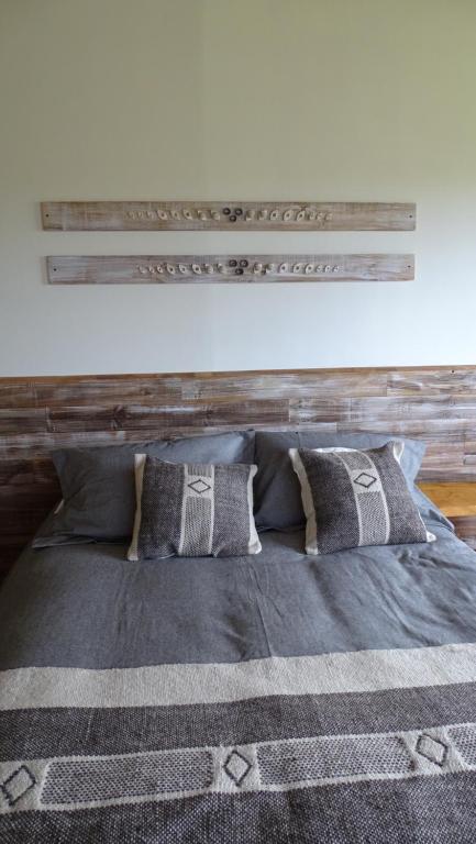 Postel nebo postele na pokoji v ubytování CABAÑAS Gracias a la Vida Lodge