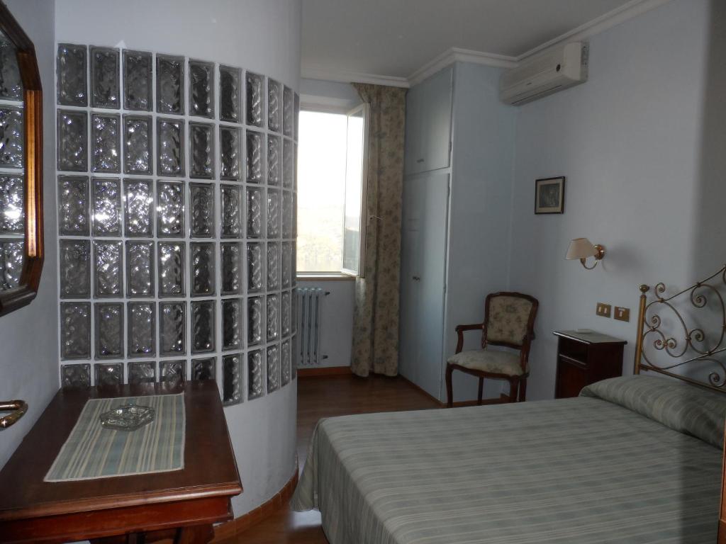 Letto o letti in una camera di Albergo Lucia Pagnanelli
