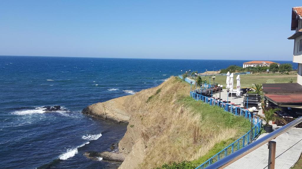 a view of the ocean from a cliff at The Yellow House in Ahtopol