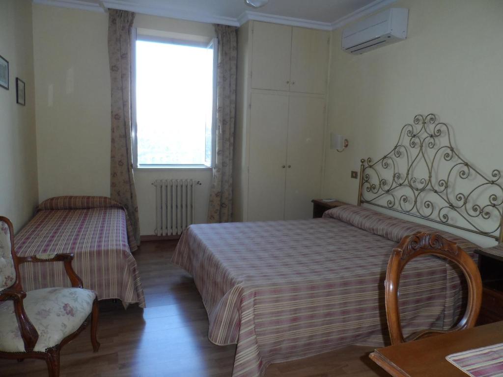 Letto o letti in una camera di Albergo Lucia Pagnanelli