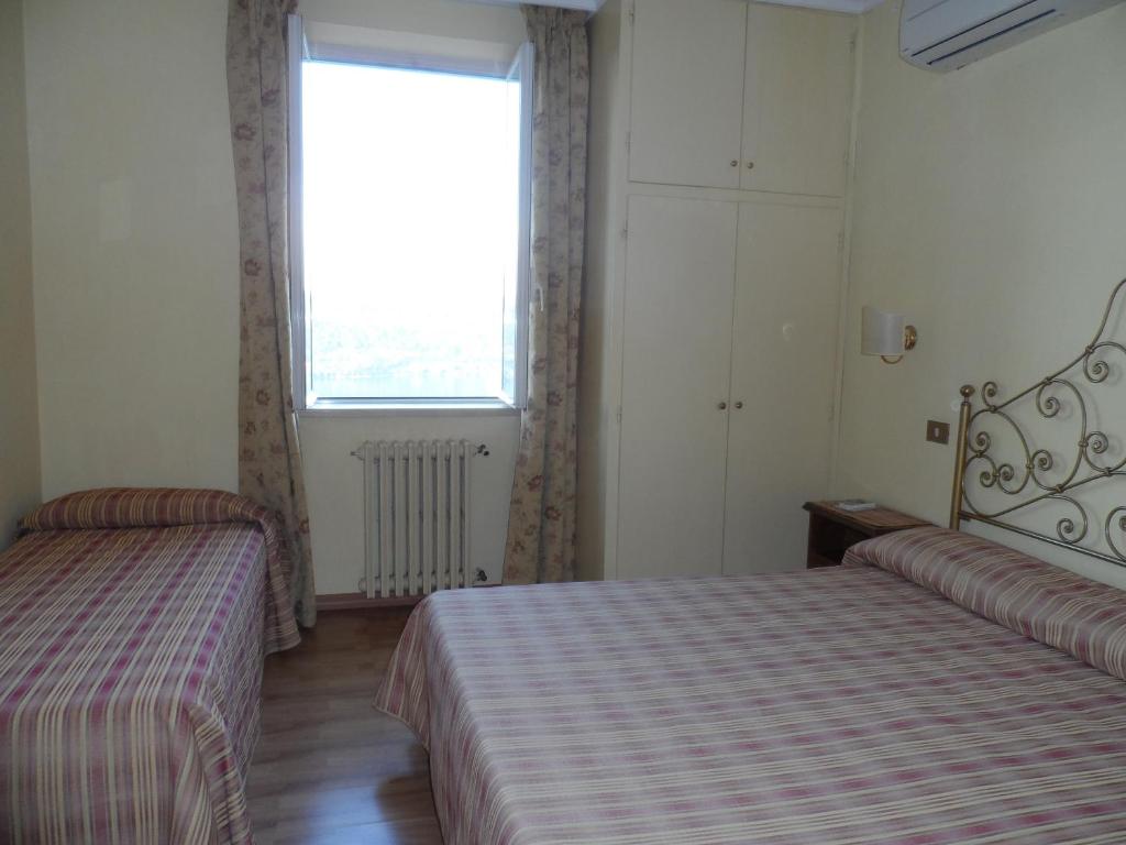 Letto o letti in una camera di Albergo Lucia Pagnanelli