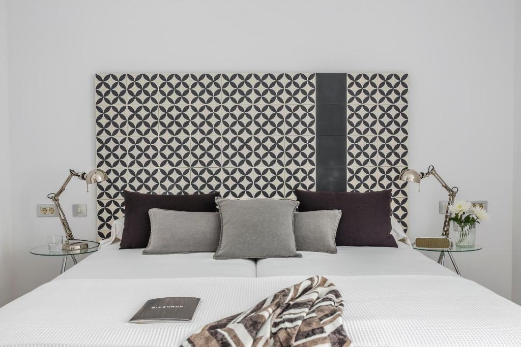 Postel nebo postele na pokoji v ubytování Eric Vökel Boutique Apartments - Atocha Suites