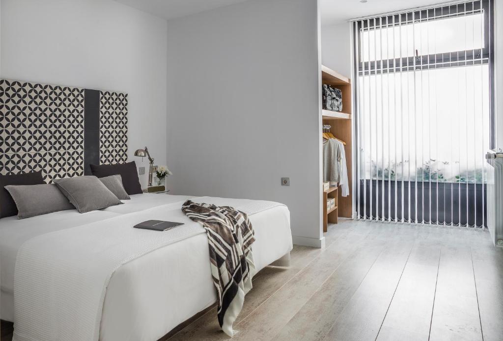 Postel nebo postele na pokoji v ubytování Eric Vökel Boutique Apartments - Atocha Suites