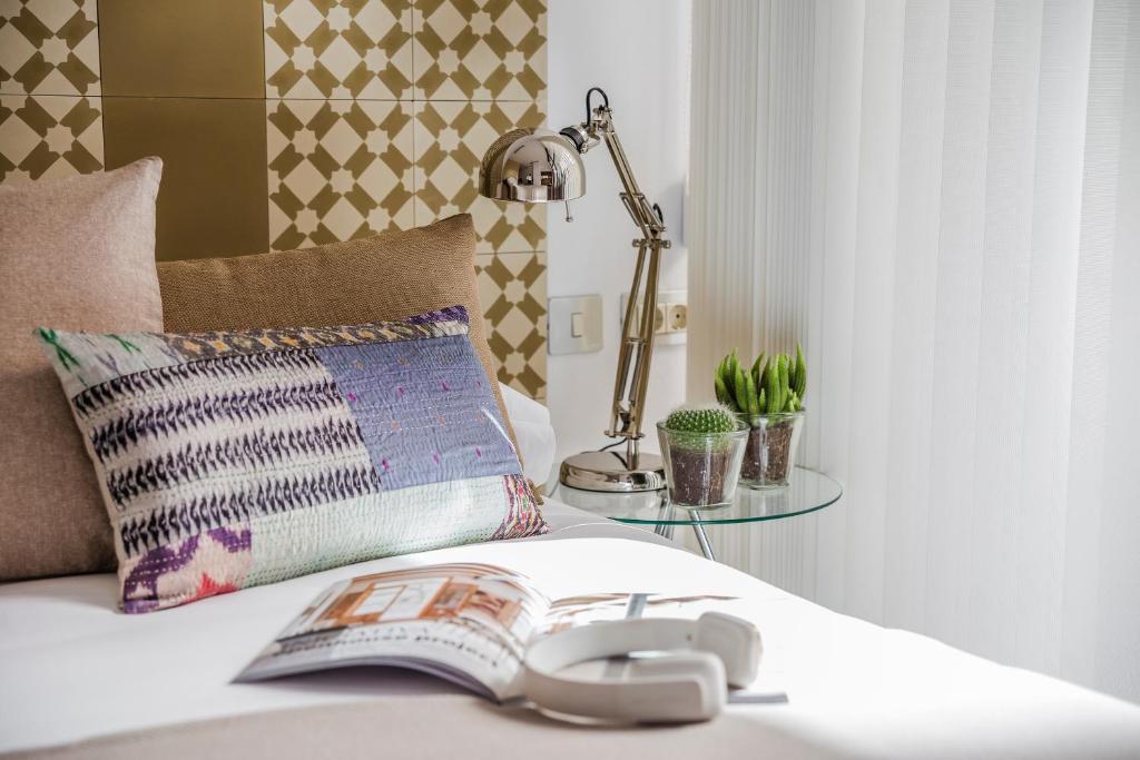 Postel nebo postele na pokoji v ubytování Eric Vökel Boutique Apartments - Atocha Suites