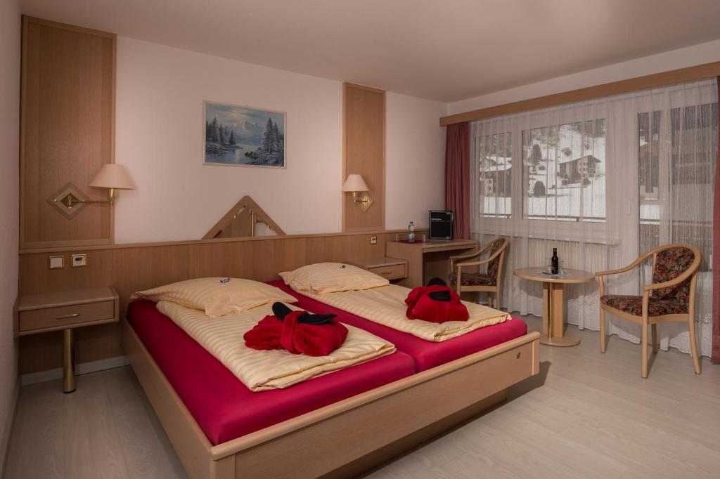 Postel nebo postele na pokoji v ubytování Wellness- und Schneesporthotel Christiania