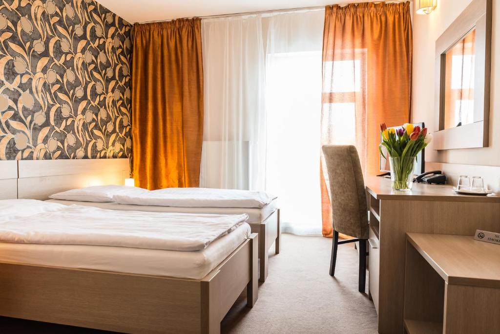 Postel nebo postele na pokoji v ubytování Hotel Dastan