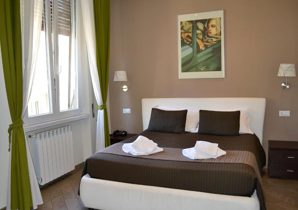 Postel nebo postele na pokoji v ubytování Mia Suites