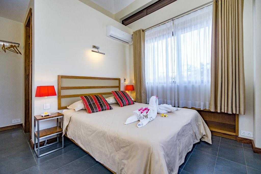 Postel nebo postele na pokoji v ubytování Villasun Luxury Apartments & Villas