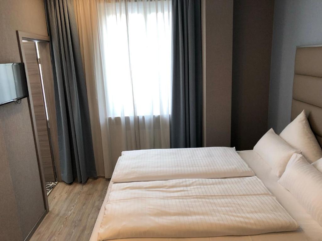 Postel nebo postele na pokoji v ubytování Belle Blue Zentrum