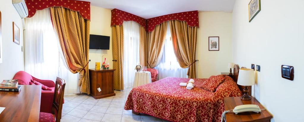 Postel nebo postele na pokoji v ubytování Hotel Il Cavalier D'Arpino