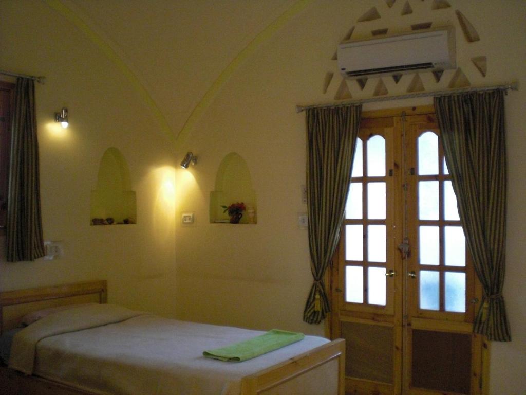 Postel nebo postele na pokoji v ubytování El Fayrouz Hotel