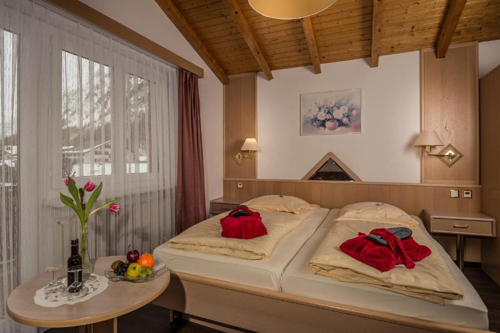Postel nebo postele na pokoji v ubytování Wellness- und Schneesporthotel Christiania