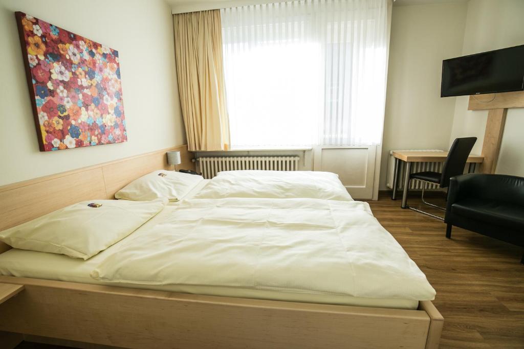 Postel nebo postele na pokoji v ubytování Bürgermeisterkapelle