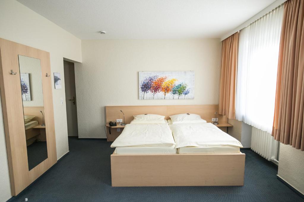 Postel nebo postele na pokoji v ubytování Bürgermeisterkapelle