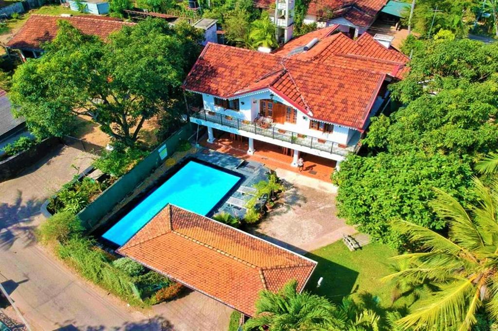 an overhead view of a house with a swimming pool at Emel Boutique in Negombo