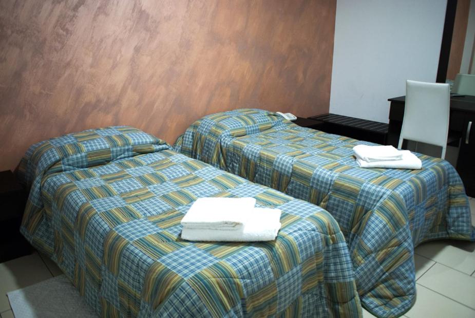 Postel nebo postele na pokoji v ubytování Hotel 660