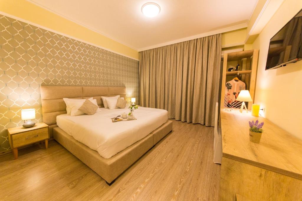 Postel nebo postele na pokoji v ubytování Hotel Baron