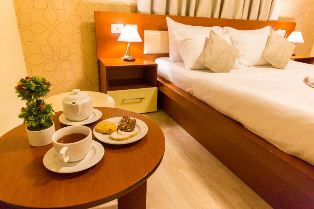 Postel nebo postele na pokoji v ubytování Hotel Baron